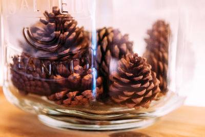 Close-up of ice cream in glass jar on table