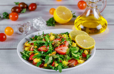 Fruits in bowl on table