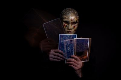 Close-up of man holding book