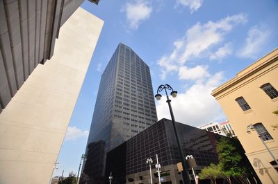 Low angle view of modern buildings against sky