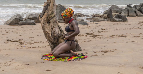 Woman on beach by sea