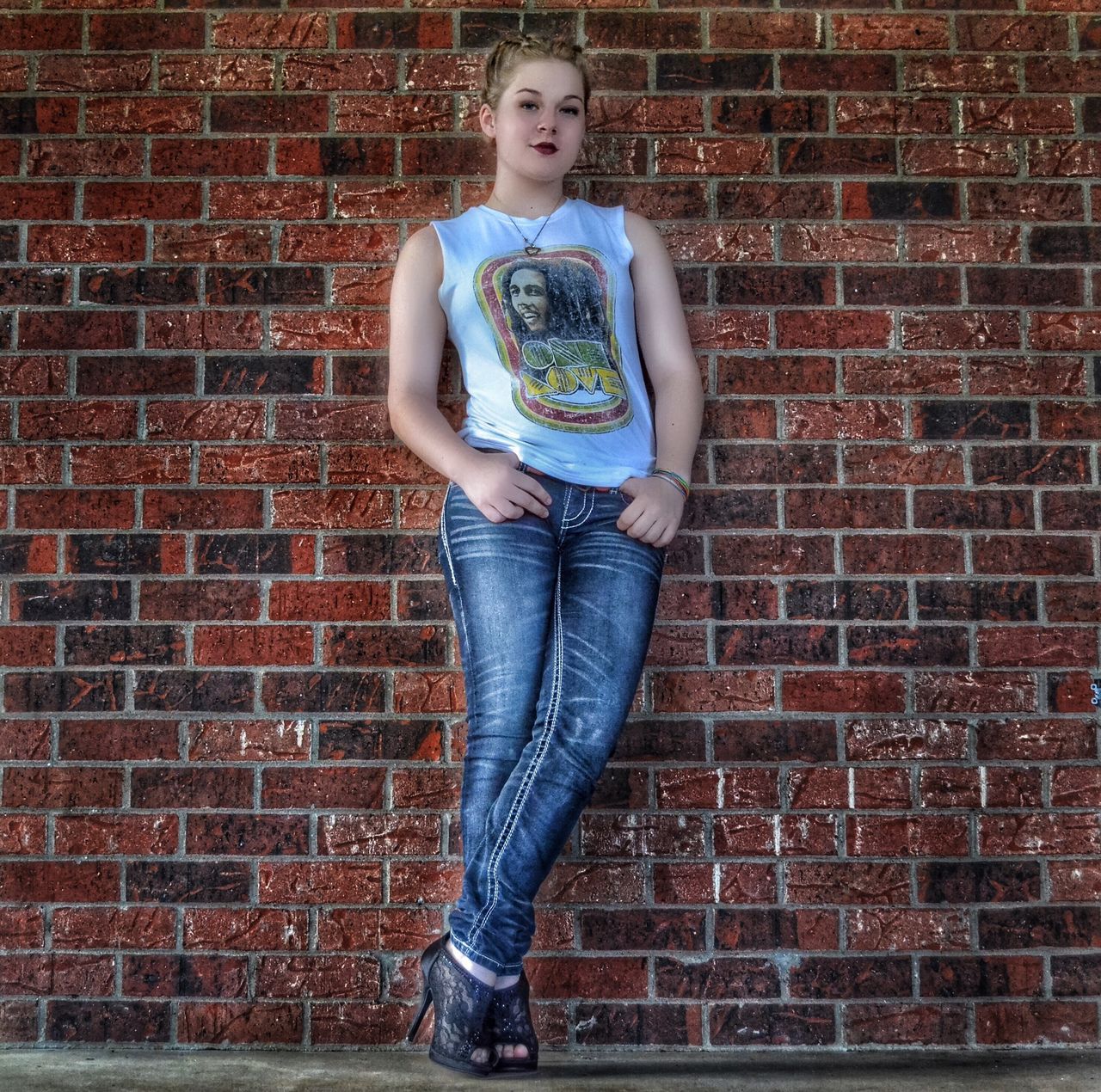 person, casual clothing, full length, front view, lifestyles, looking at camera, portrait, standing, brick wall, young adult, childhood, smiling, elementary age, leisure activity, happiness, wall - building feature, young women, three quarter length