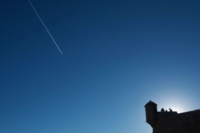 Low angle view of built structure against clear blue sky