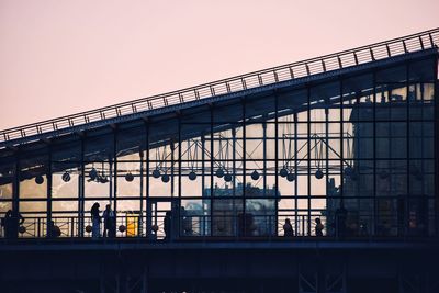 Low angle view of bridge against sky during sunset