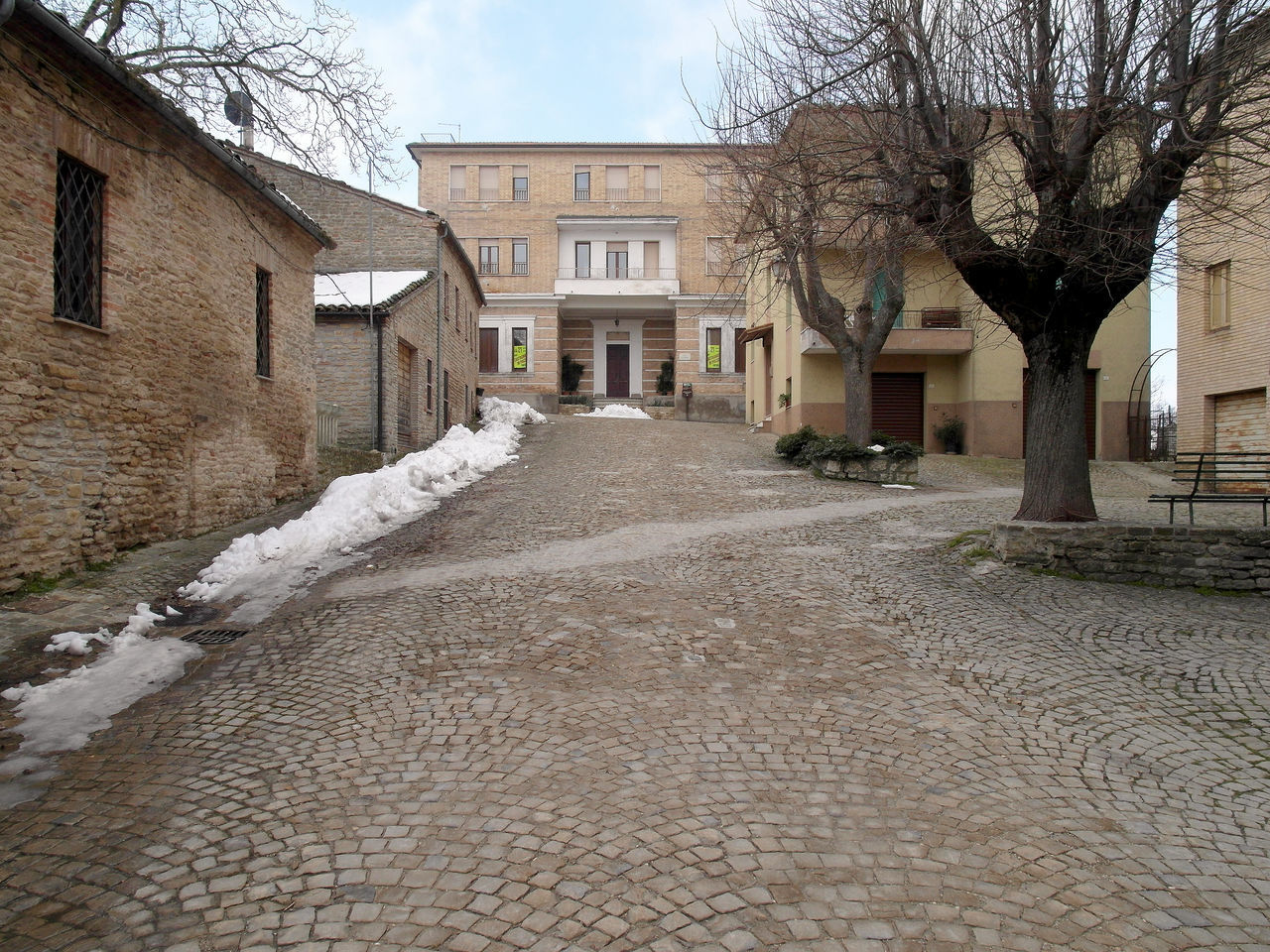 VIEW OF ROAD ALONG BUILDINGS