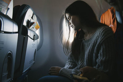 Woman sitting in window