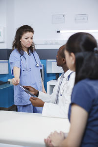 Doctor examining patient at clinic