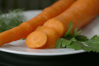 Close-up of orange slice in plate