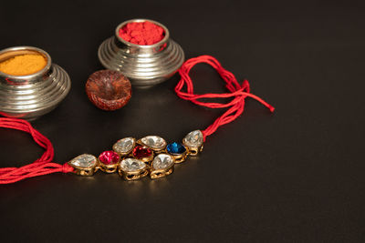 High angle view of decorations on table against black background