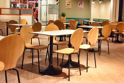 Empty chairs and table in cafe