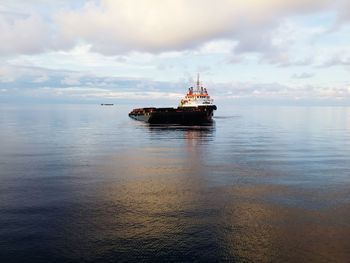 Nautical vessel on sea against sky