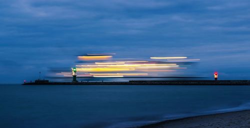 Scenic view of sea against sky at night