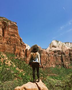 Woman standing on rock formation