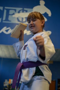 Girl  posing in martial arts uniform