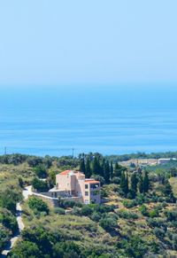 Scenic view of sea and buildings against sky