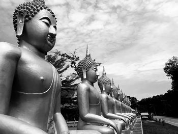 Statue of buddha against building