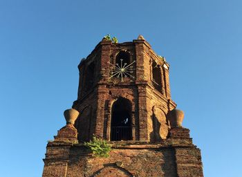 Low angle view of historic building against clear blue sky