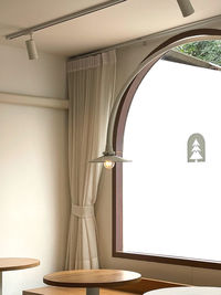 Low angle view of lamp on table in building