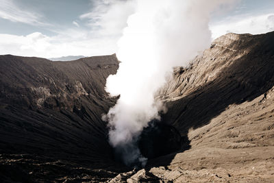 Smoke emitting from volcanic mountain