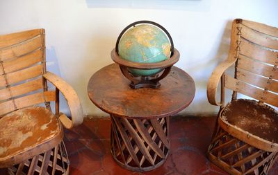 High angle view of empty chairs on table