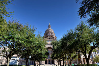 Low angle view of building against blue sky