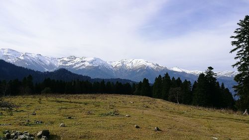 Scenic view of mountains against sky during winter