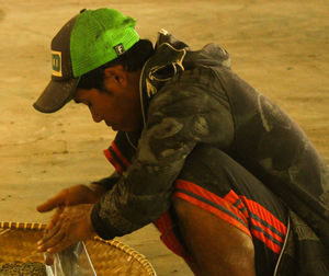 Side view of young man standing outdoors