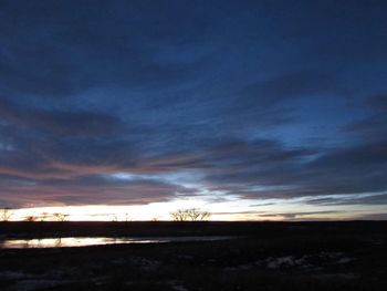Scenic view of landscape against cloudy sky