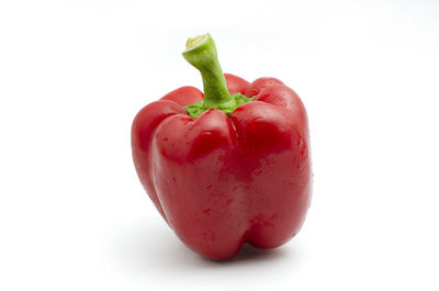 Close-up of wet strawberry against white background