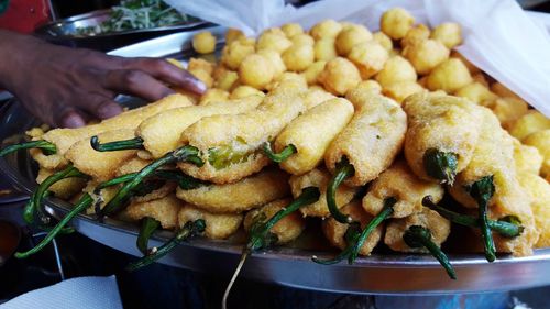 Close-up of person preparing food on table