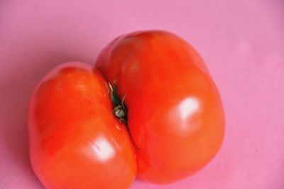 Close-up of tomatoes against red background