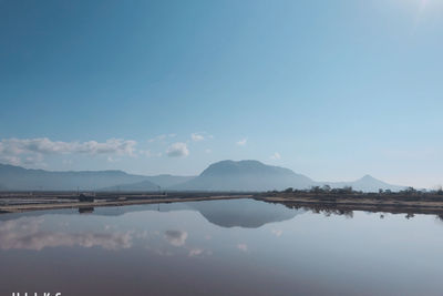 Scenic view of lake against blue sky