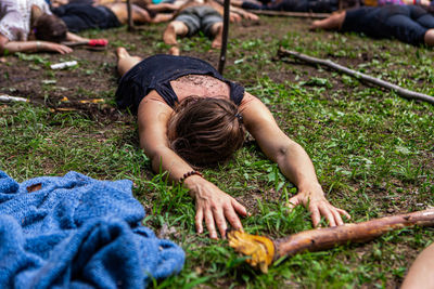 High angle view of man lying on land