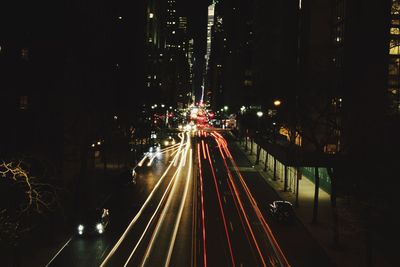 High angle view of light trails on road at night