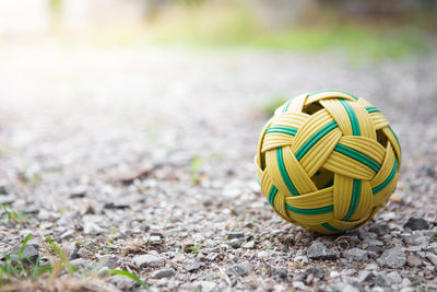 Close-up of multi colored ball on field