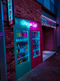 Information sign on illuminated store at night