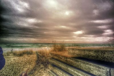 Scenic view of sea against cloudy sky