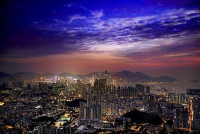 Cityscape against cloudy sky