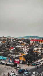 High angle view of city street and buildings against sky