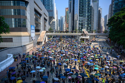 Group of people on modern buildings in city