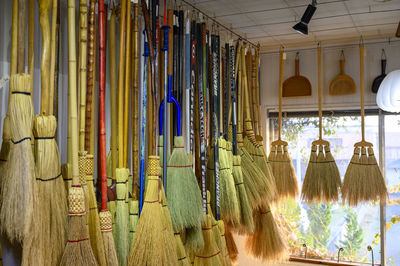 Custom brooms made of hockey sticks in a small shop in japan.