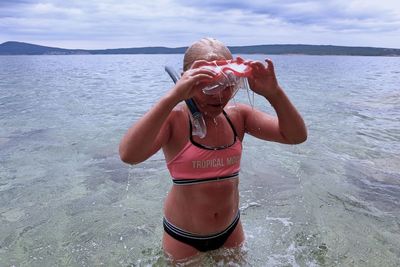 Girl with snorkel in sea