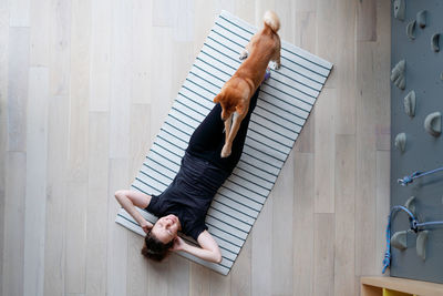 High angle view of woman resting on floor