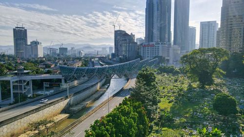 Aerial view of modern buildings in city against sky