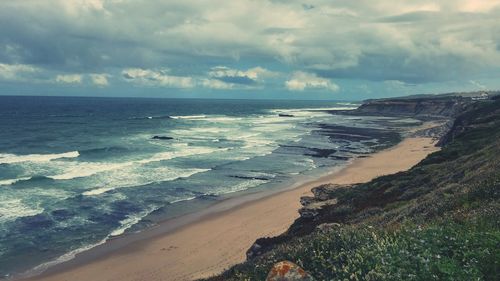 Scenic view of beach against sky