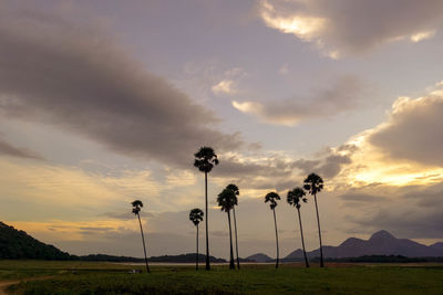 Scenic view of landscape against cloudy sky