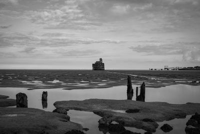 People on beach against sky