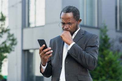 Young man using mobile phone