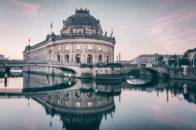 Reflection of building over river