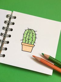 Drawing in book against green background